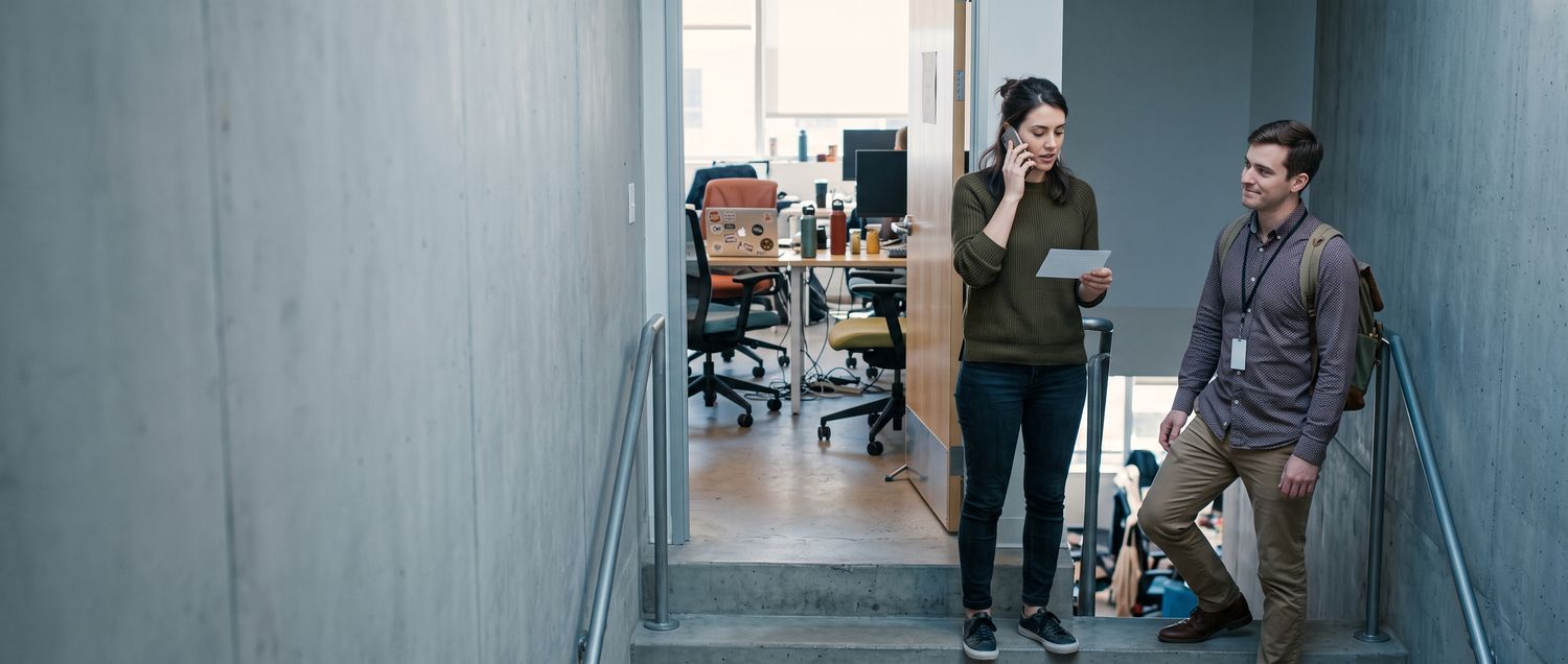 A rep in a stairwell mid-voicemail — the moment the script is meant to serve.
